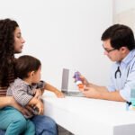 side-view-mother-paying-attention-doctor-s-visit