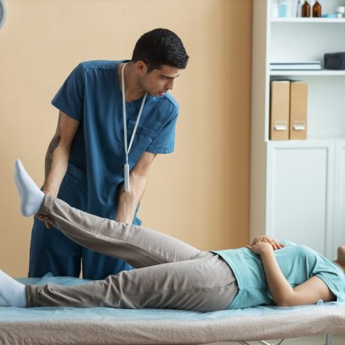 doctor-helping-patient-rehabilitation